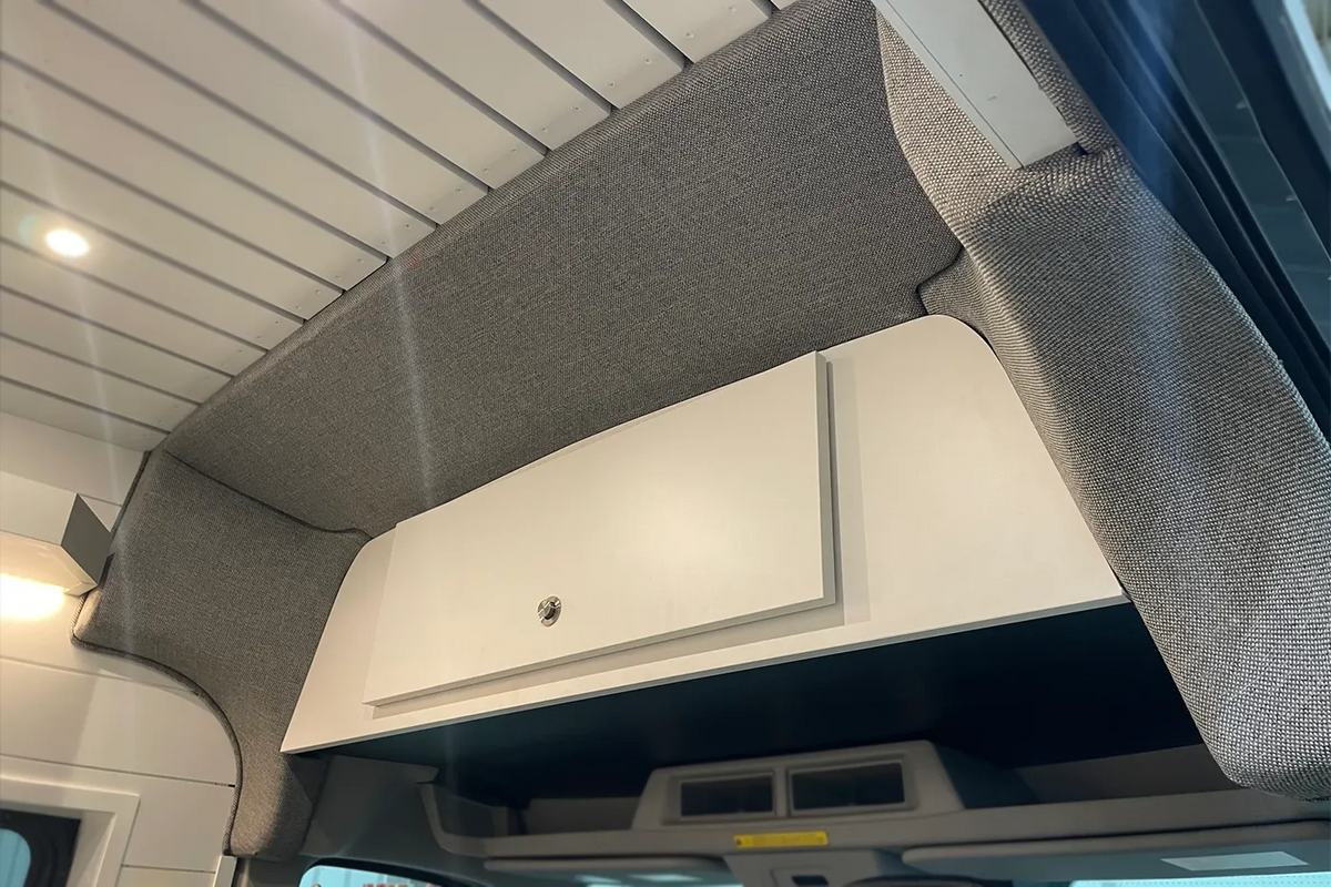 Ford Transit High Roof front trim installed, bulkhead transition close-up - grey